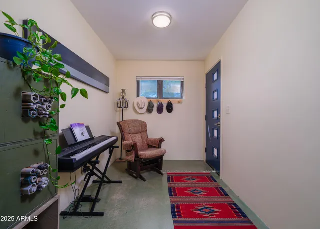 a living room with furniture and a lamp