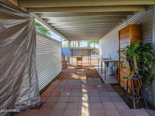 an aerial view of a house with a yard basket ball court and outdoor seating