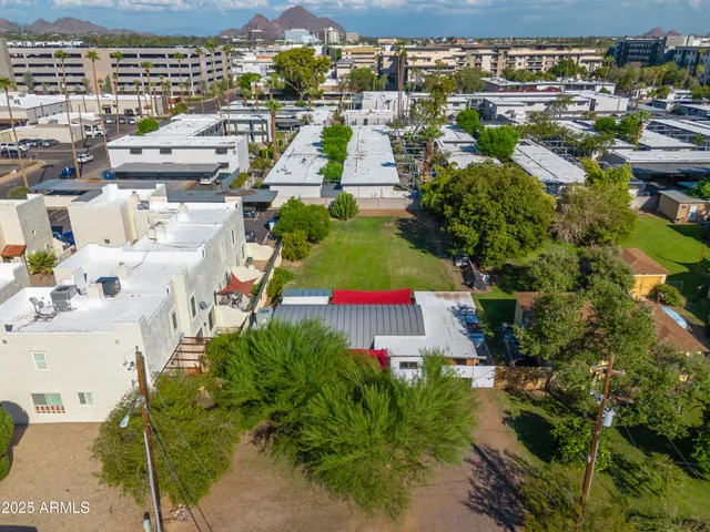 a view of an house with swimming pool garden and trees