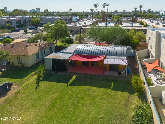 a view of a swimming pool and lounge chairs