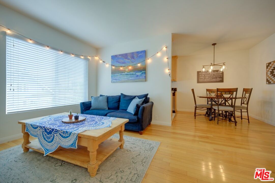1918 11th Street, Unit F Santa Monica, CA 90404 - Photo 2 of 14 a living room with furniture and a table