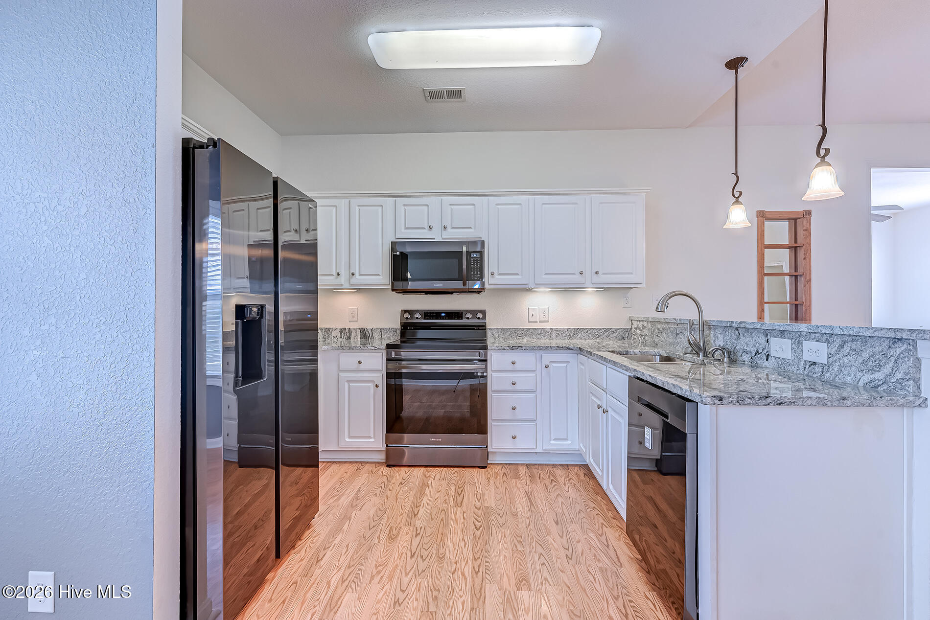 379 Wampee Street Calabash, NC 28467 - Photo 27 of 46 379Wampee-kitchen4