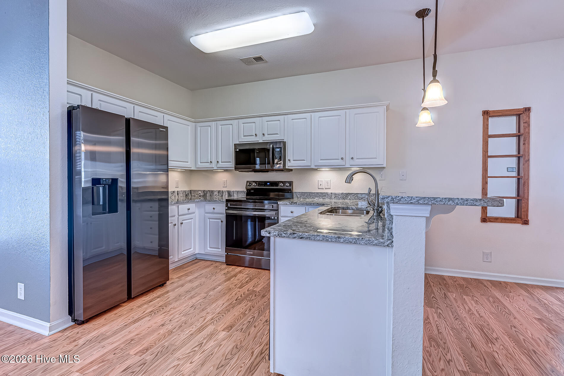 379 Wampee Street Calabash, NC 28467 - Photo 28 of 46 379Wampee-kitchen3
