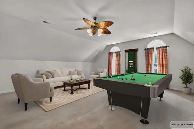 a white bath tub sitting next to a white toilet