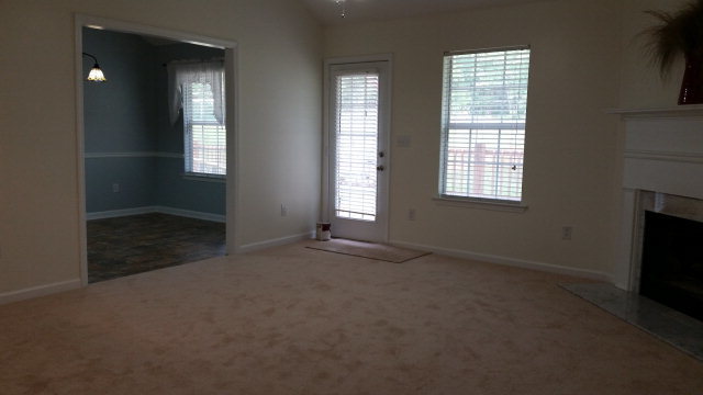 250 Autumn Ridge Court Gray, GA 31032 - Photo 5 of 12 an empty room with windows and fireplace