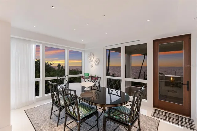 a living room with lots of furniture and a chandelier