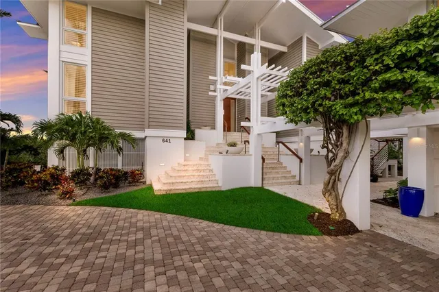 a outdoor living space with furniture and a fireplace