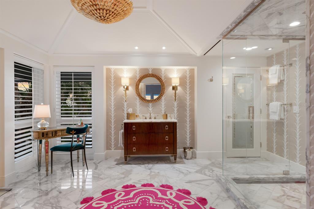 641 Boca Bay Drive Boca Grande, FL 33921 - Photo 35 of 98 a bathroom with a mirror and a shower