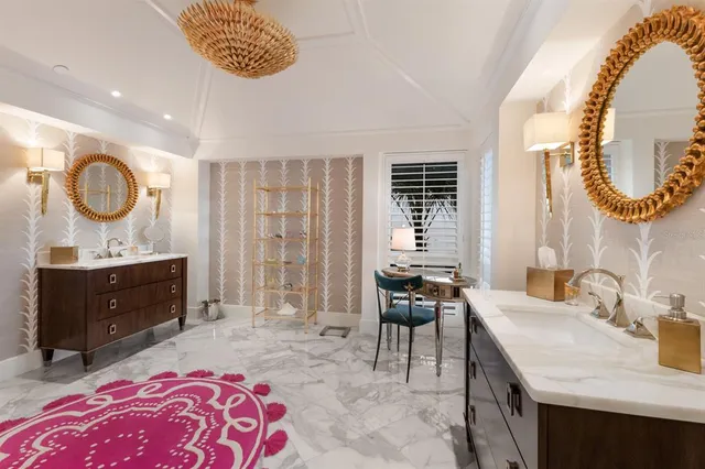 an aerial view of a house with a yard and lake view