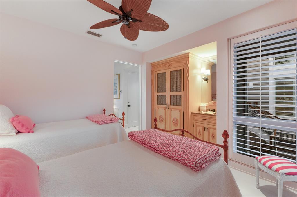 641 Boca Bay Drive Boca Grande, FL 33921 - Photo 43 of 98 a bedroom with a bed and a window