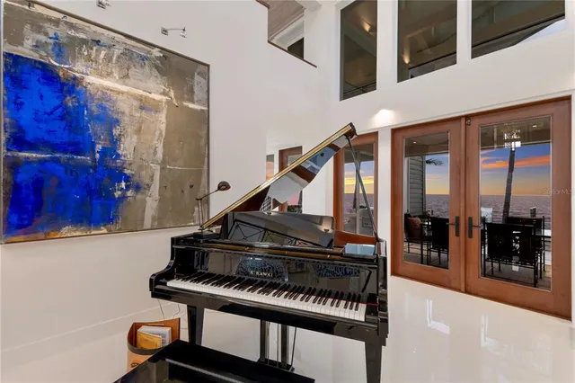 a large space with a large mirror and furniture