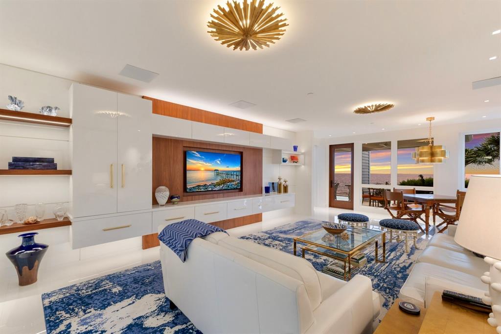 641 Boca Bay Drive Boca Grande, FL 33921 - Photo 8 of 98 a living room with furniture and a flat screen tv