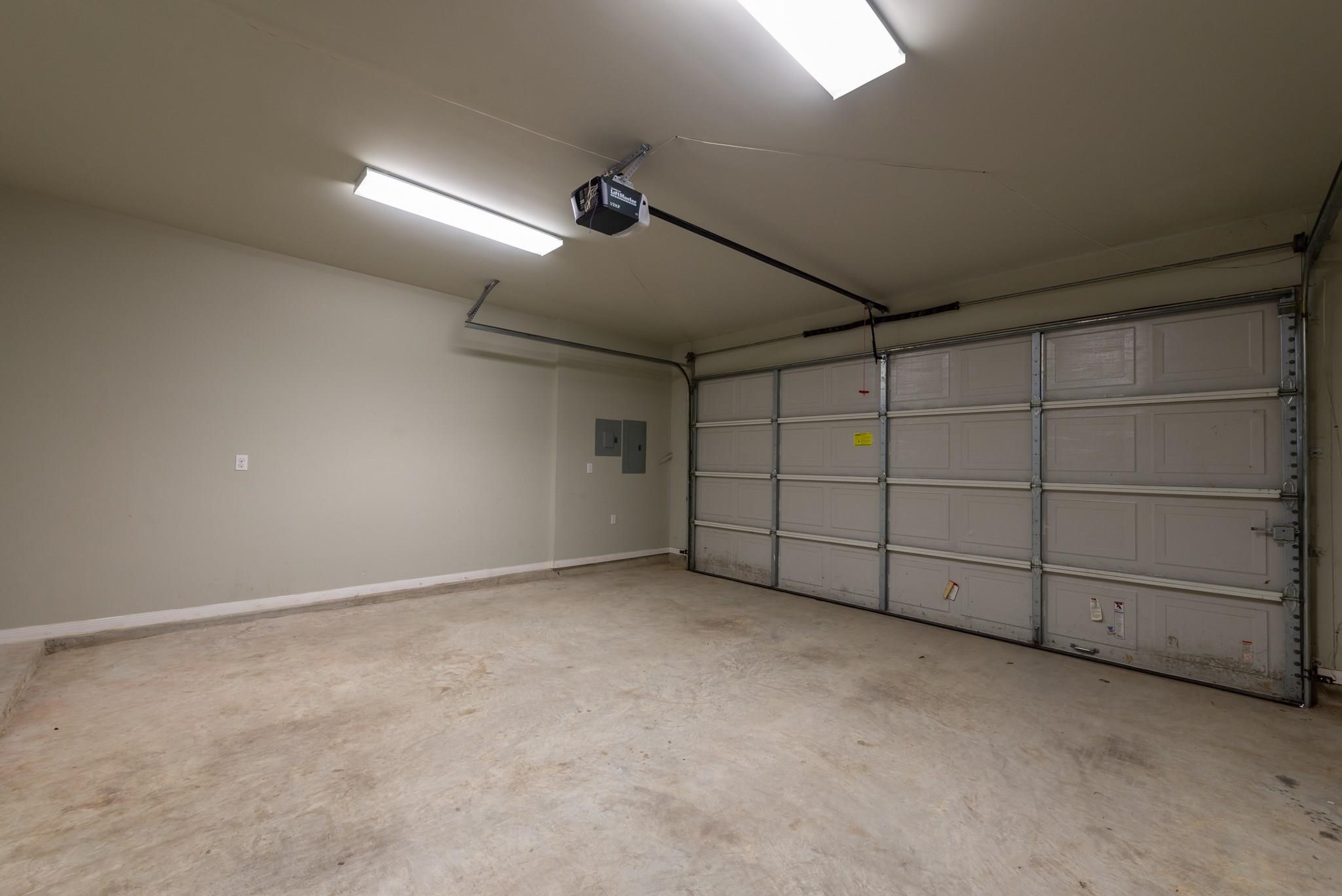 734 Allston Street, Unit B Houston, TX 77007 - Photo 25 of 28 The 2 car garage has ample room garage door opener that you access from the alley behind the home.