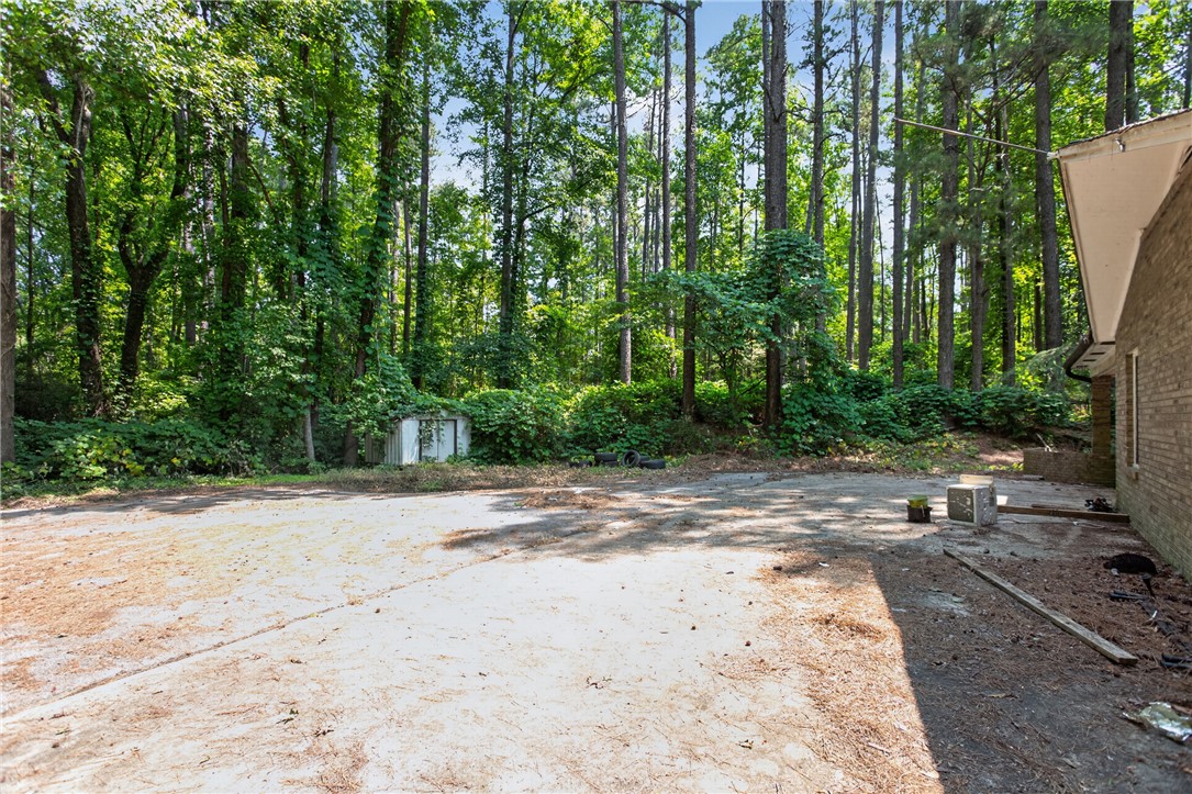 123 Robin Road Westminster, SC 29693 - Photo 10 of 50 Mature trees and a verdant backdrop frame this spacious, private lot.