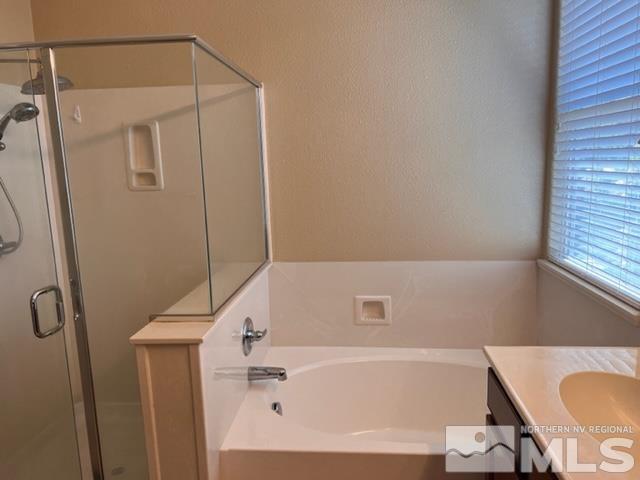 360 Stradella Way Reno, NV 89521 - Photo 3 of 4 a bathroom with a bathtub and a shower