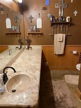a bathroom with a sink and mirror