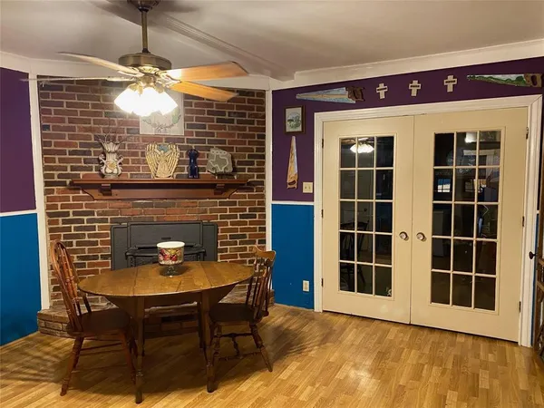 a view of a house with a table and chairs