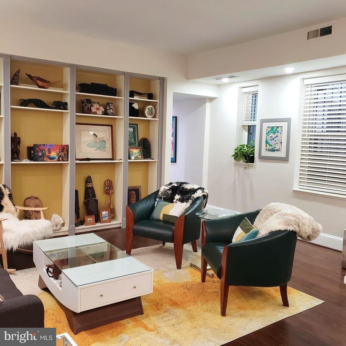 2127 California Street Northwest, Unit 102 Washington, DC 20008 - Photo 2 of 10 a living room with furniture and a window
