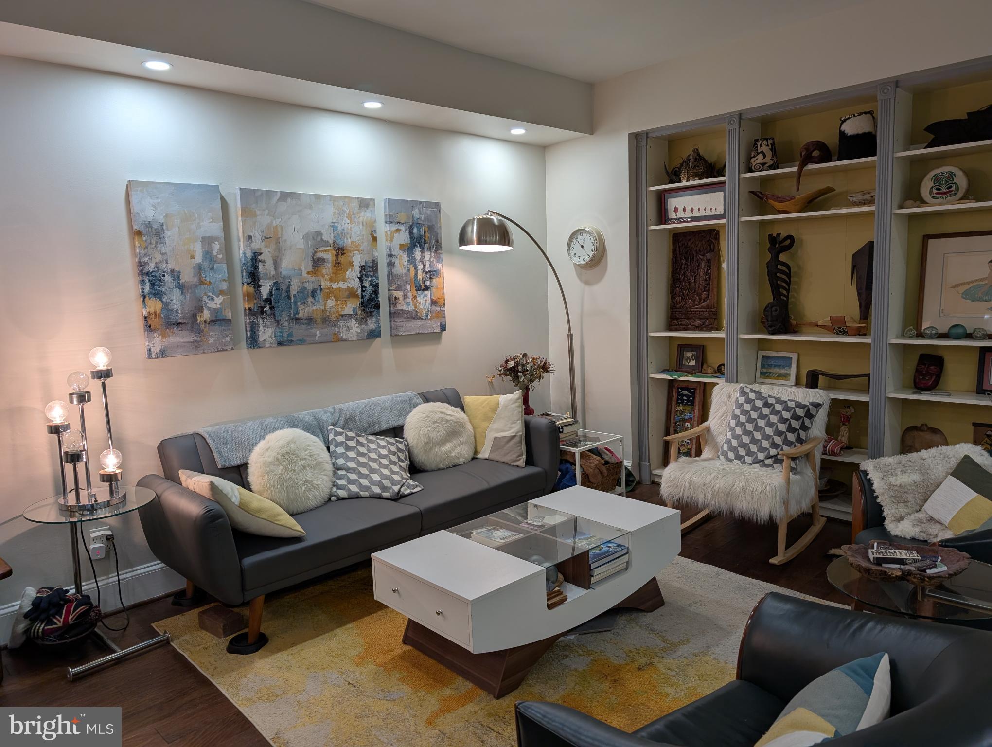2127 California Street Northwest, Unit 102 Washington, DC 20008 - Photo 10 of 10 a living room with furniture rug and wall painting