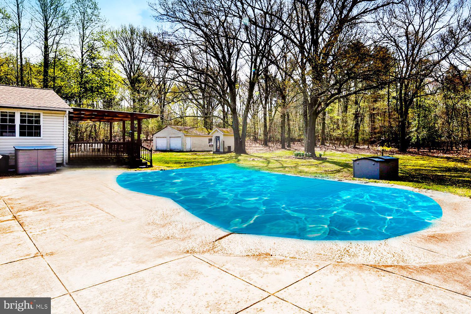 1661 Fairview Beach Road Pasadena, MD 21122 - Photo 19 of 37 Sparkling Pool with Sunbathing Surround