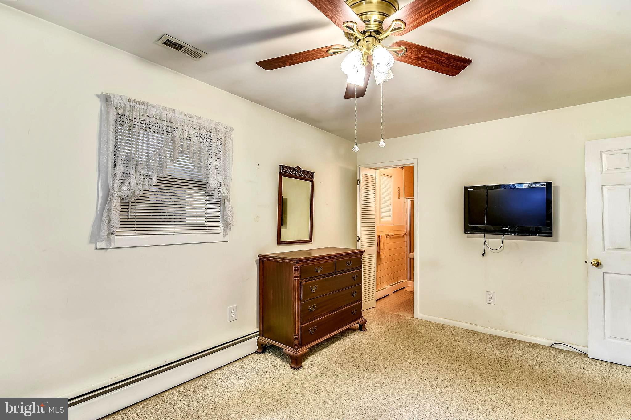 1661 Fairview Beach Road Pasadena, MD 21122 - Photo 21 of 37 Generous Master Bedroom with En Suite Bath