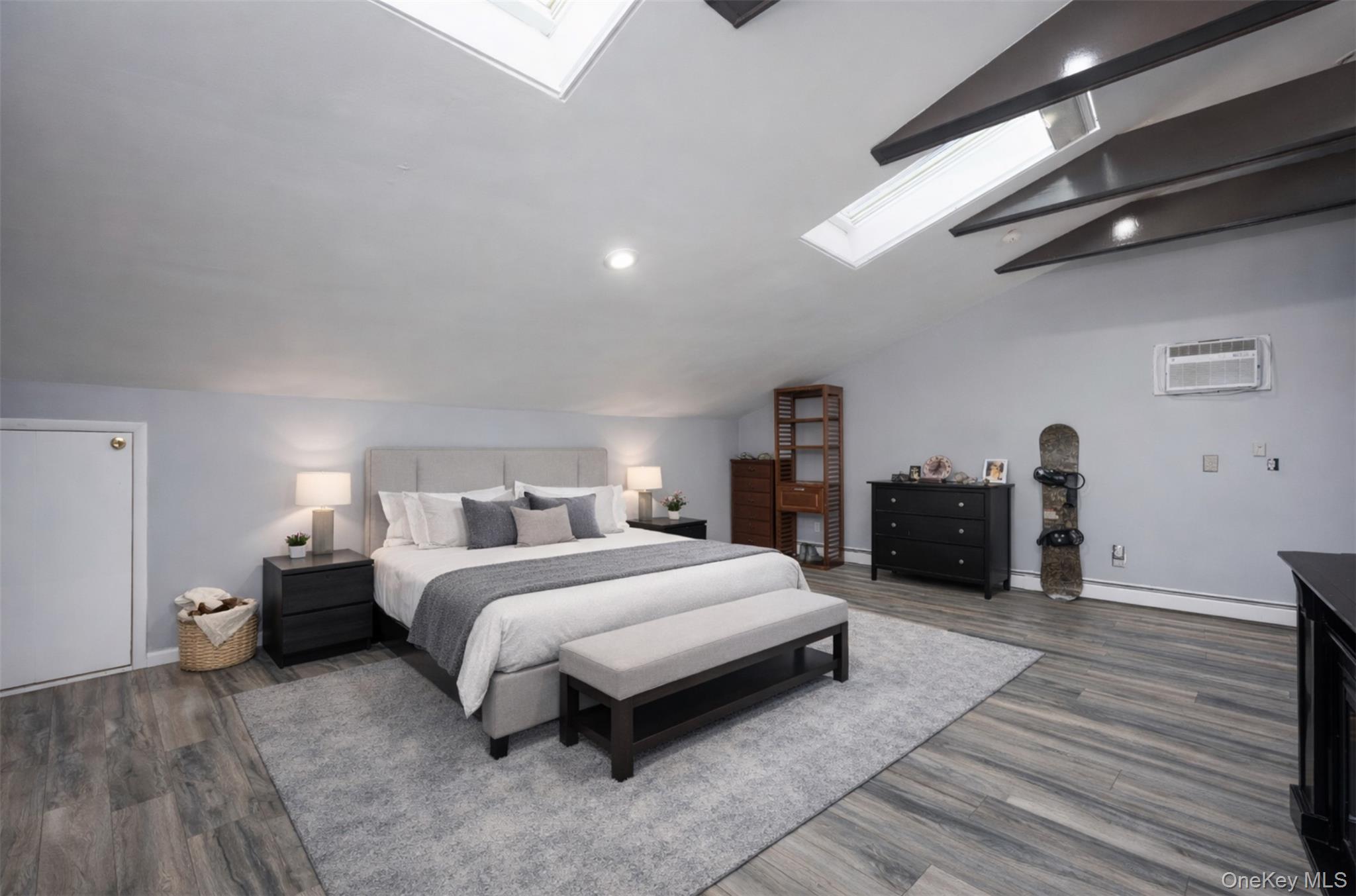 27 Spice Hill Road Croton-on-Hudson, NY 10520 - Photo 12 of 20 a spacious bedroom with a bed and a view of kitchen