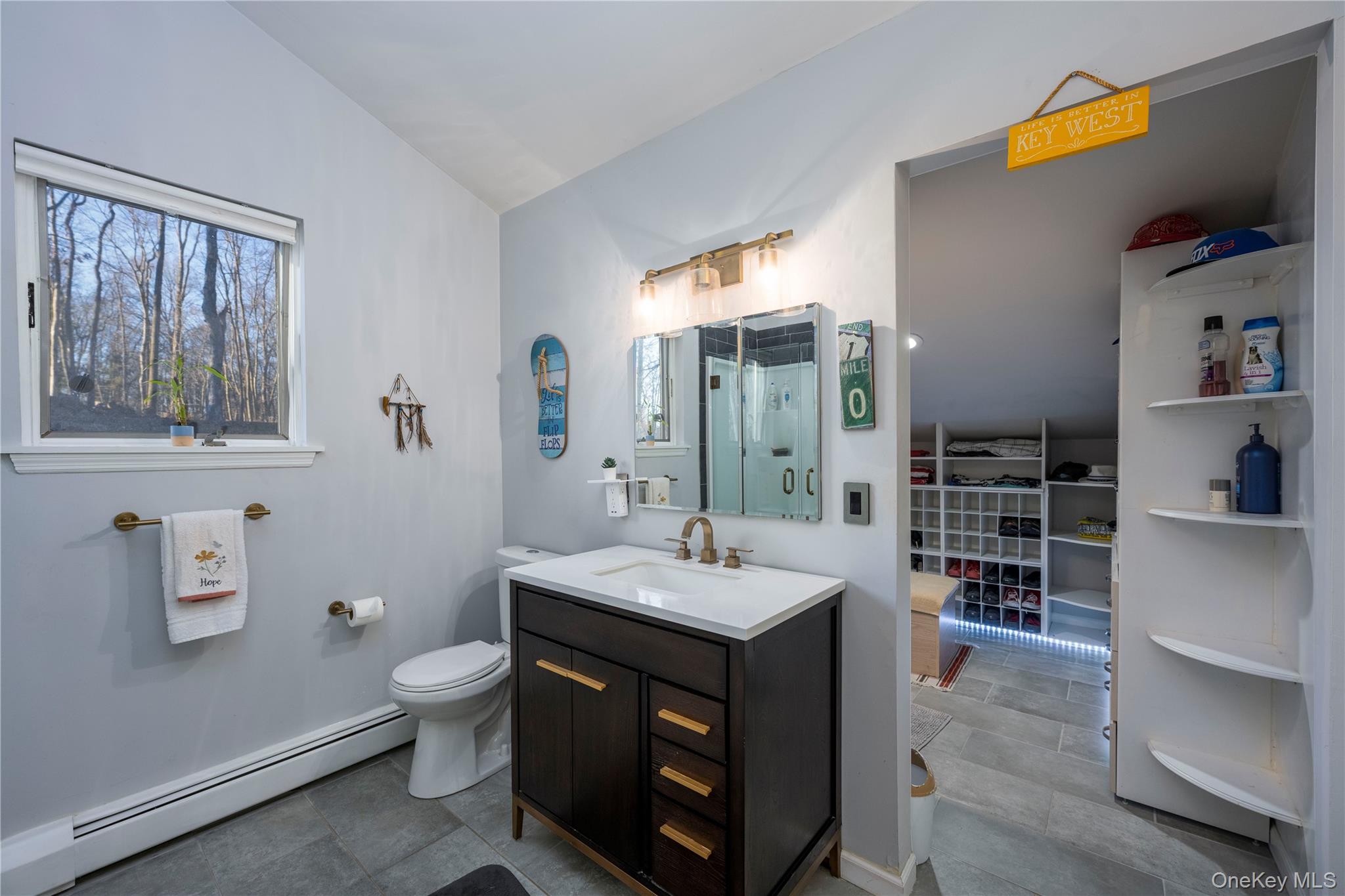 27 Spice Hill Road Croton-on-Hudson, NY 10520 - Photo 16 of 20 a bathroom with a sink a vanity and a toilet