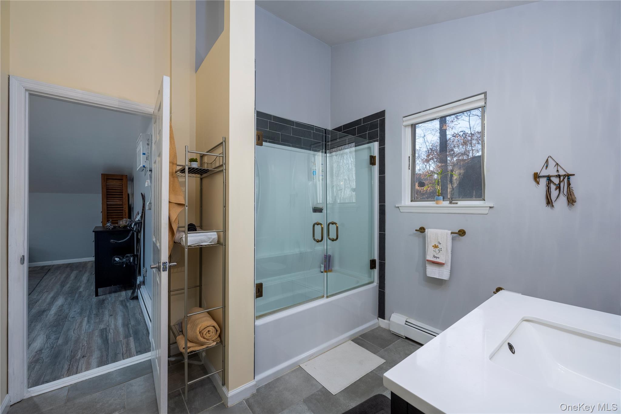 27 Spice Hill Road Croton-on-Hudson, NY 10520 - Photo 17 of 20 a bathroom with a bathtub and a shower