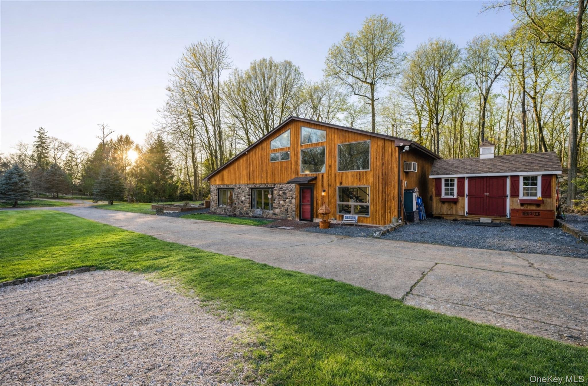 27 Spice Hill Road Croton-on-Hudson, NY 10520 - Photo 4 of 20 a front view of a house with a yard