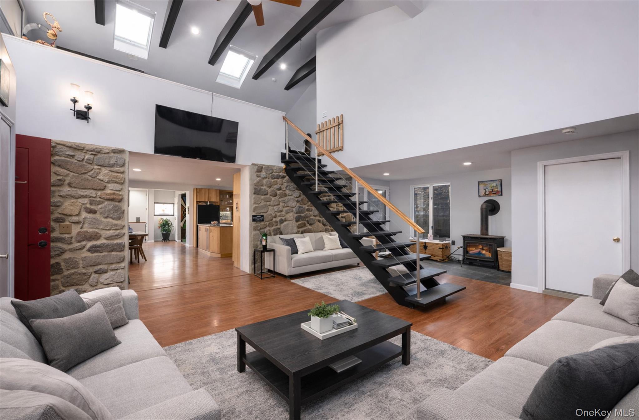 27 Spice Hill Road Croton-on-Hudson, NY 10520 - Photo 6 of 20 a living room with furniture and a flat screen tv