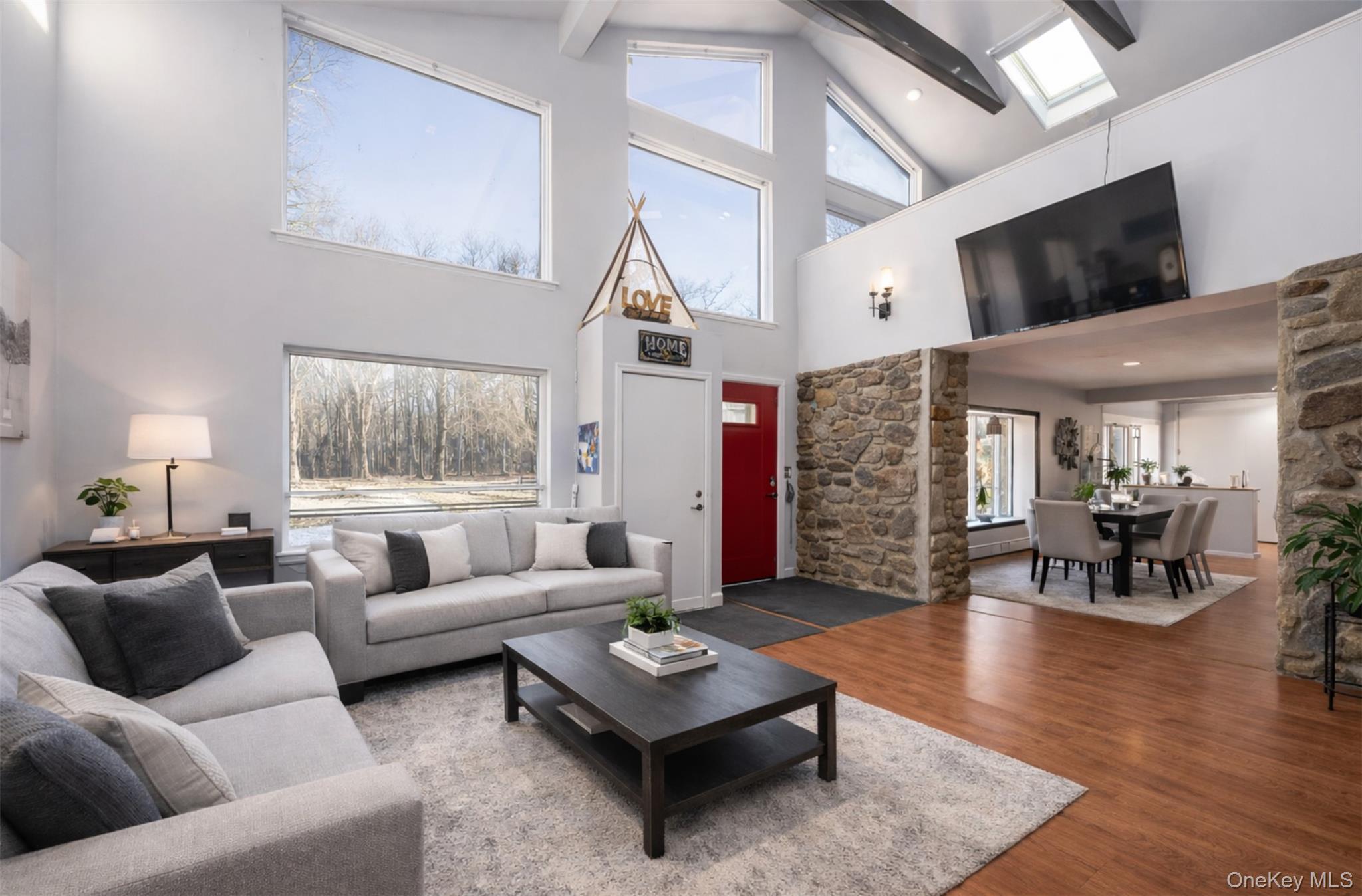 27 Spice Hill Road Croton-on-Hudson, NY 10520 - Photo 7 of 20 a living room with furniture and a large window
