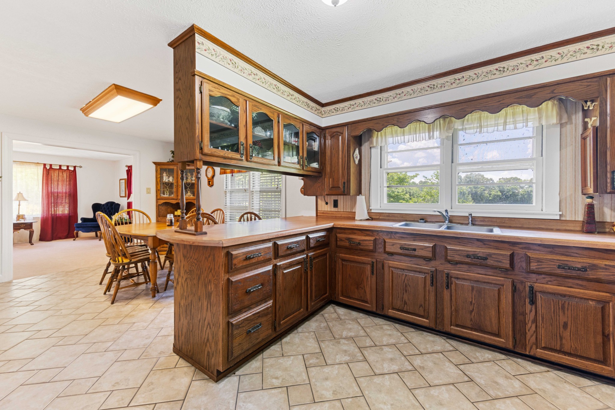 4519 Highway 100 Decaturville, TN 38329 - Photo 16 of 31 a kitchen with a stove a sink and a refrigerator