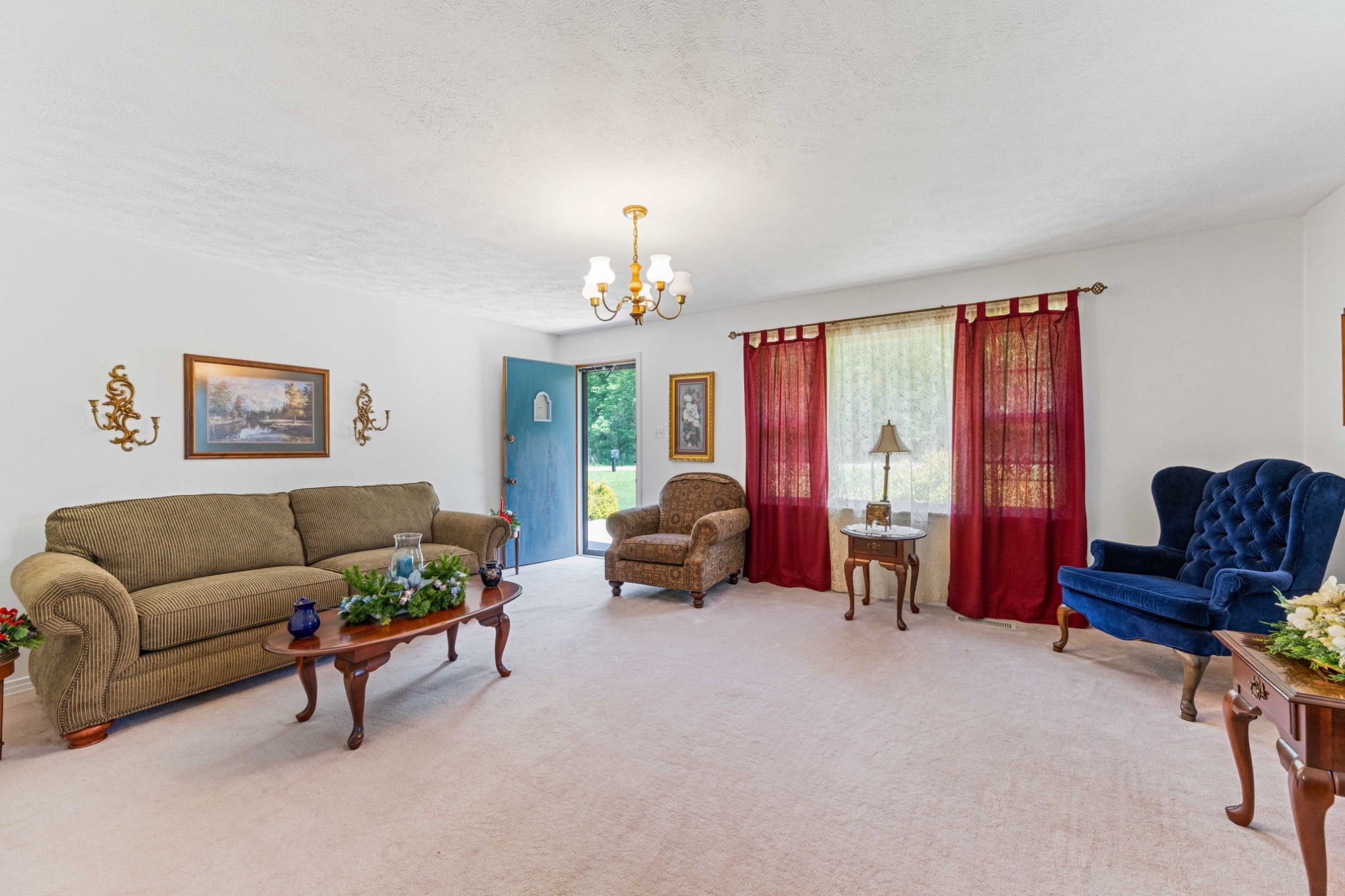 4519 Highway 100 Decaturville, TN 38329 - Photo 18 of 31 a living room with furniture and a chandelier
