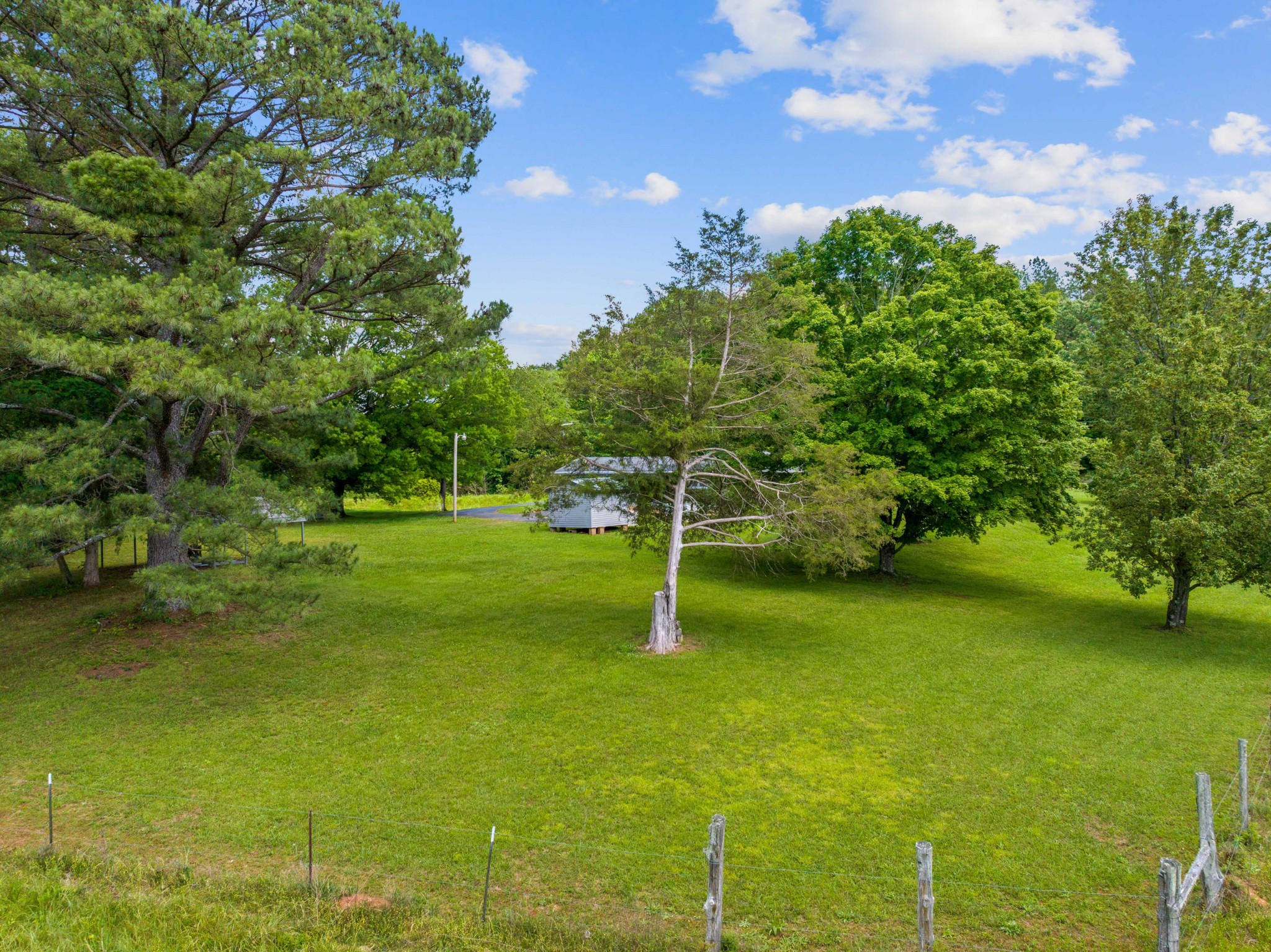 4519 Highway 100 Decaturville, TN 38329 - Photo 21 of 31 a view of a golf course with a lake