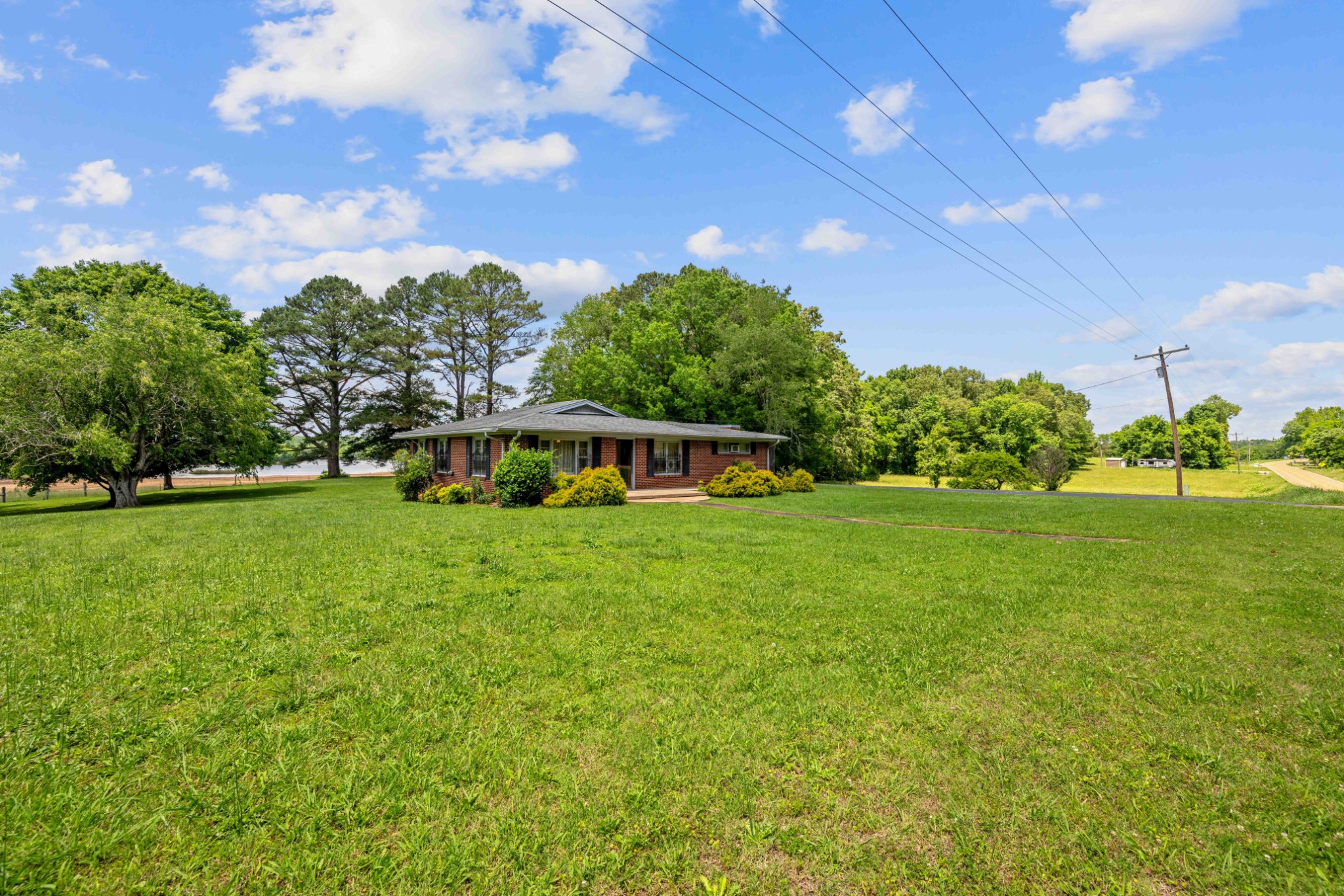 4519 Highway 100 Decaturville, TN 38329 - Photo 29 of 31 a view of a house with a big yard plants and large trees