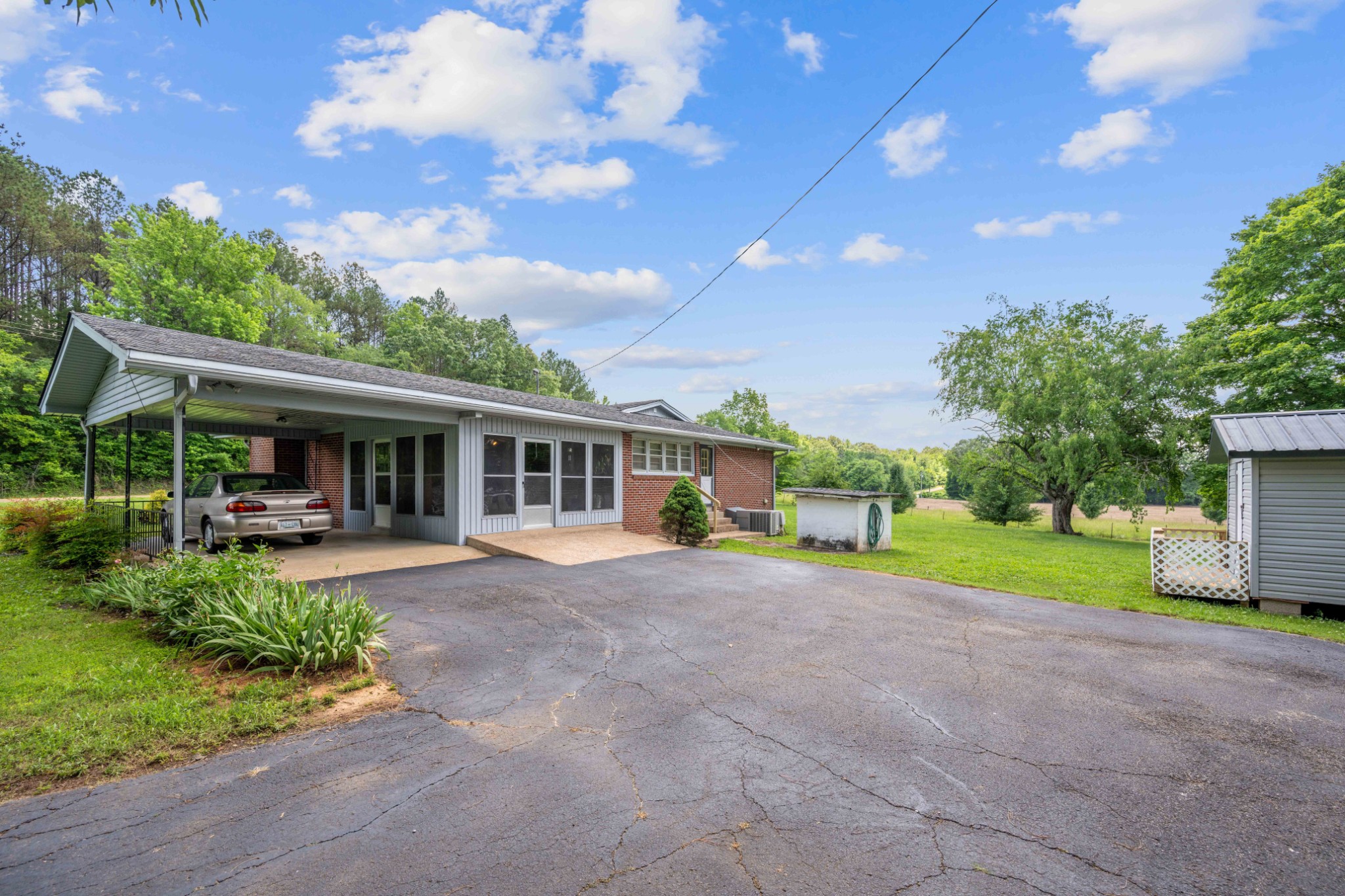 4519 Highway 100 Decaturville, TN 38329 - Photo 5 of 31 a view of a house with backyard and sitting area