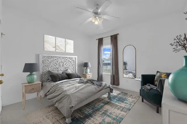 a bedroom with bed and window