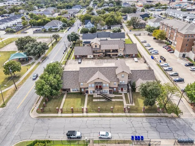 an aerial view of a house with a swimming pool