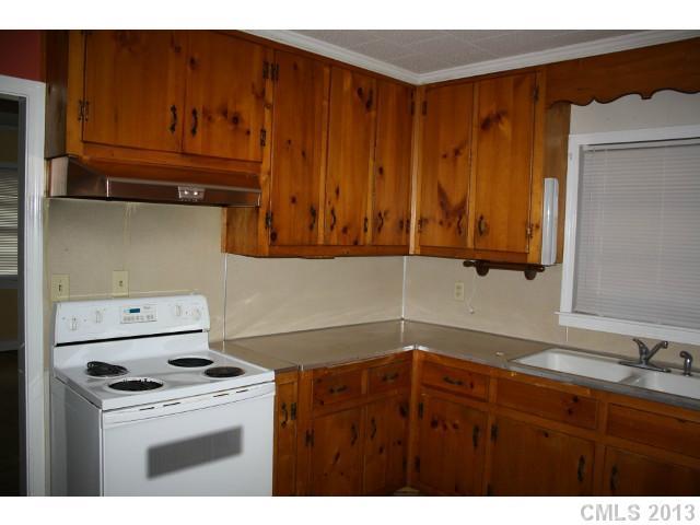 735 Belleview Road Rock Hill, SC 29730 - Photo 4 of 12 a kitchen with a stove and a cabinet
