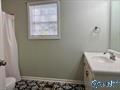 70 Covington Rdg Drive Jacksonville, AL 36265 - Photo 27 of 42 a bathroom with a sink and a window