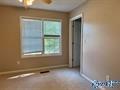 70 Covington Rdg Drive Jacksonville, AL 36265 - Photo 31 of 42 a view of an empty room with a window