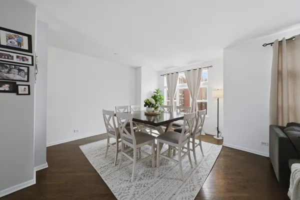 a view of a dining room with furniture and window