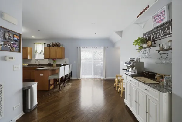a kitchen with stainless steel appliances a stove top oven a sink a counter space and cabinets
