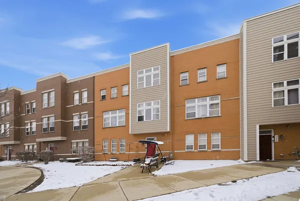 a front view of a building with a street view