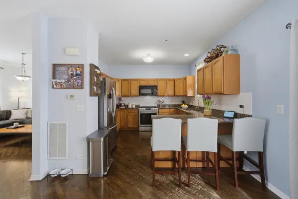a view of a dining room with furniture and wooden floor