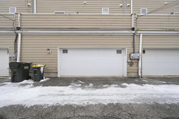 a view of a front door and a garage