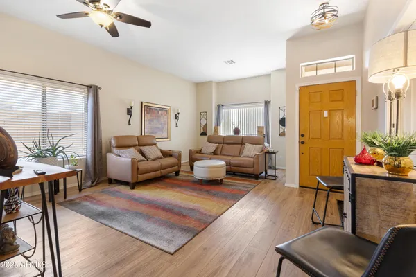 a bedroom with a bed window and couch