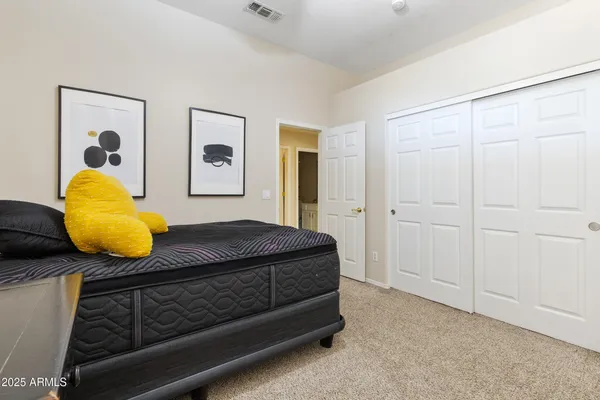 a bedroom with a bed and a table