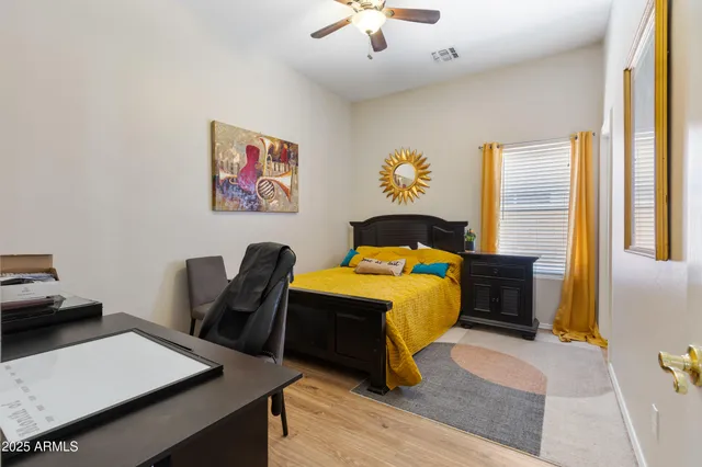 a bed room with a bed and a flat screen tv