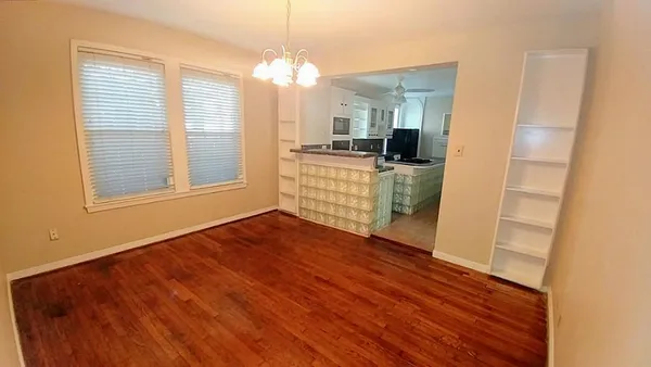 a view of a kitchen cabinets and wooden floor